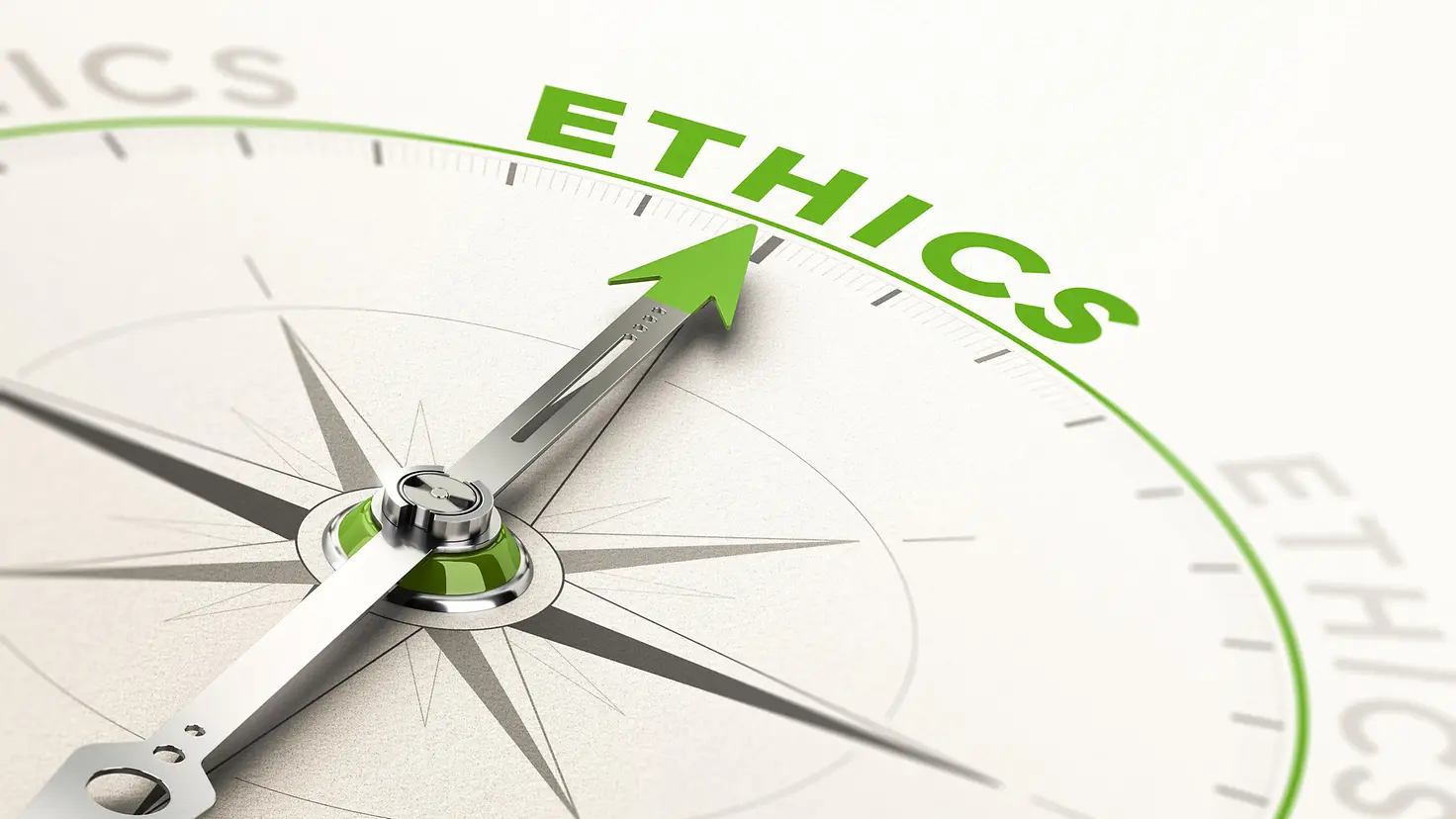 Ein Pfeil auf einem Kompass zeigt auf das Wort Ethics (englisch für Ethik).